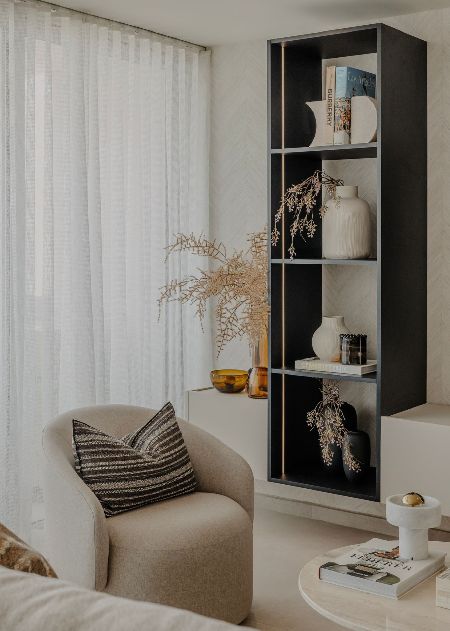 Open shelving with ceramics and oak boards.
